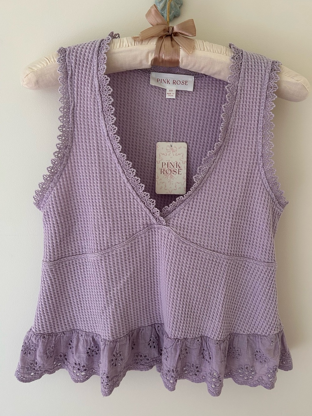 Pink Rose Waffle Knit Peplum Lilac Crop Top with Eyelet Trim
Size: XS
NWT